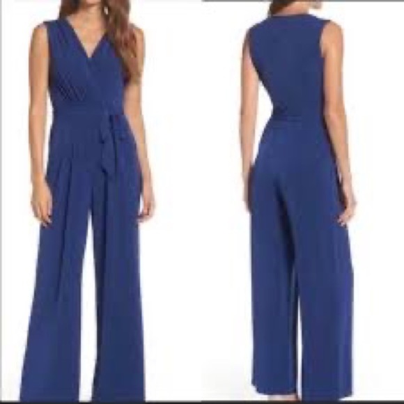 Vince Camuto Pants - Vince Camuto jumpsuit with great pockets and tie on waist. Zipper in bac…